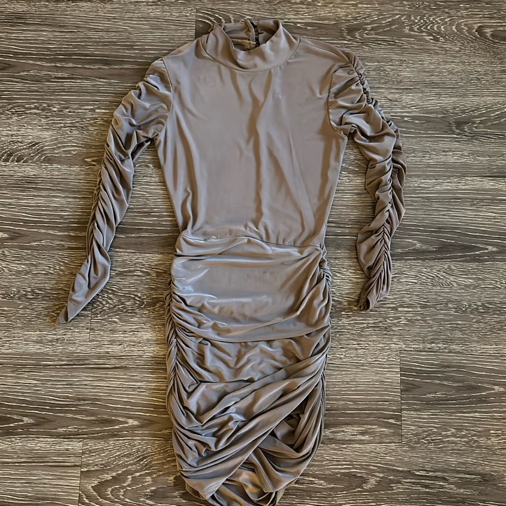 Tan body on dress with ruffled sleeves and front part.